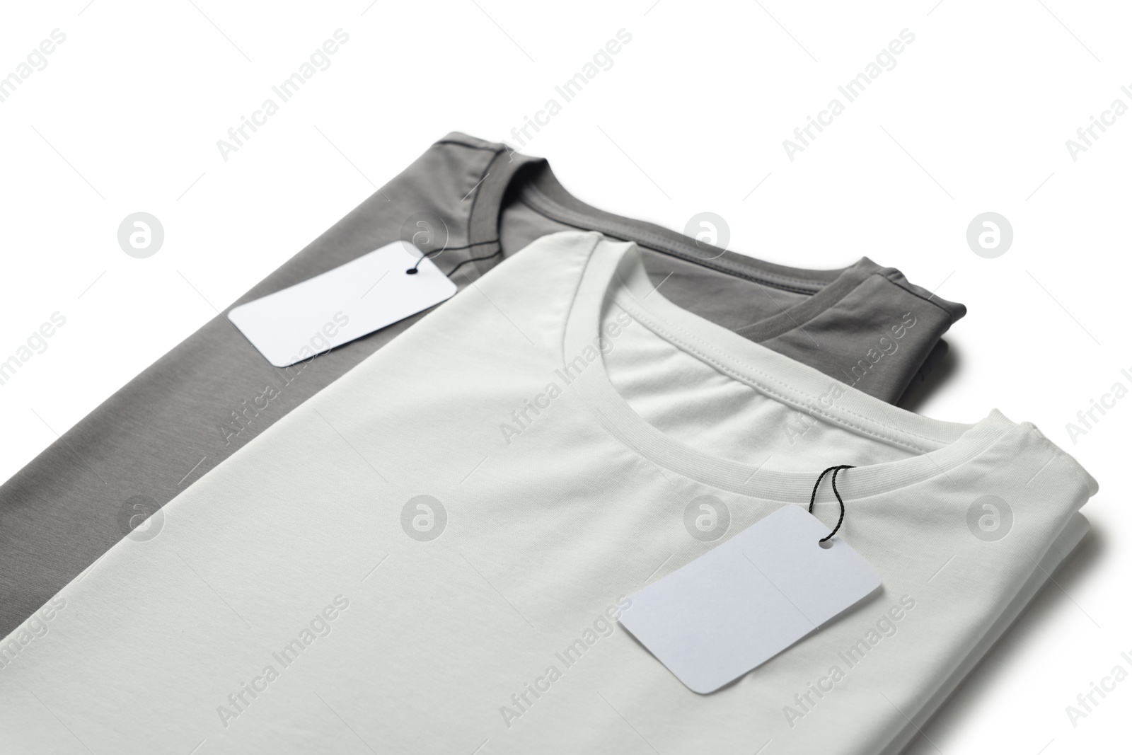 Image of White and grey t-shirts with tags on white background. Mockup for design