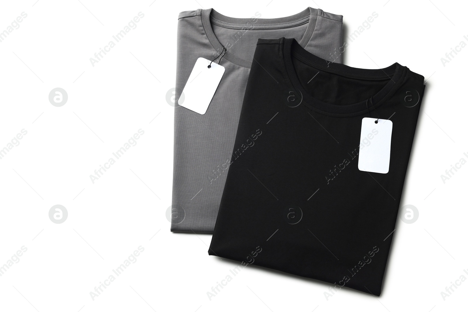 Image of Black and grey t-shirts with tags on white background, top view. Mockup for design