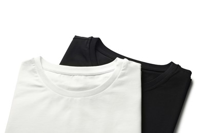 Image of White and black t-shirts on white background, top view. Mockup for design