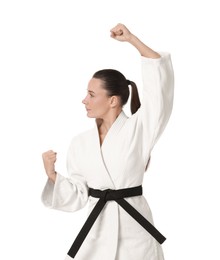 Photo of Young woman in kimono practicing karate on white background