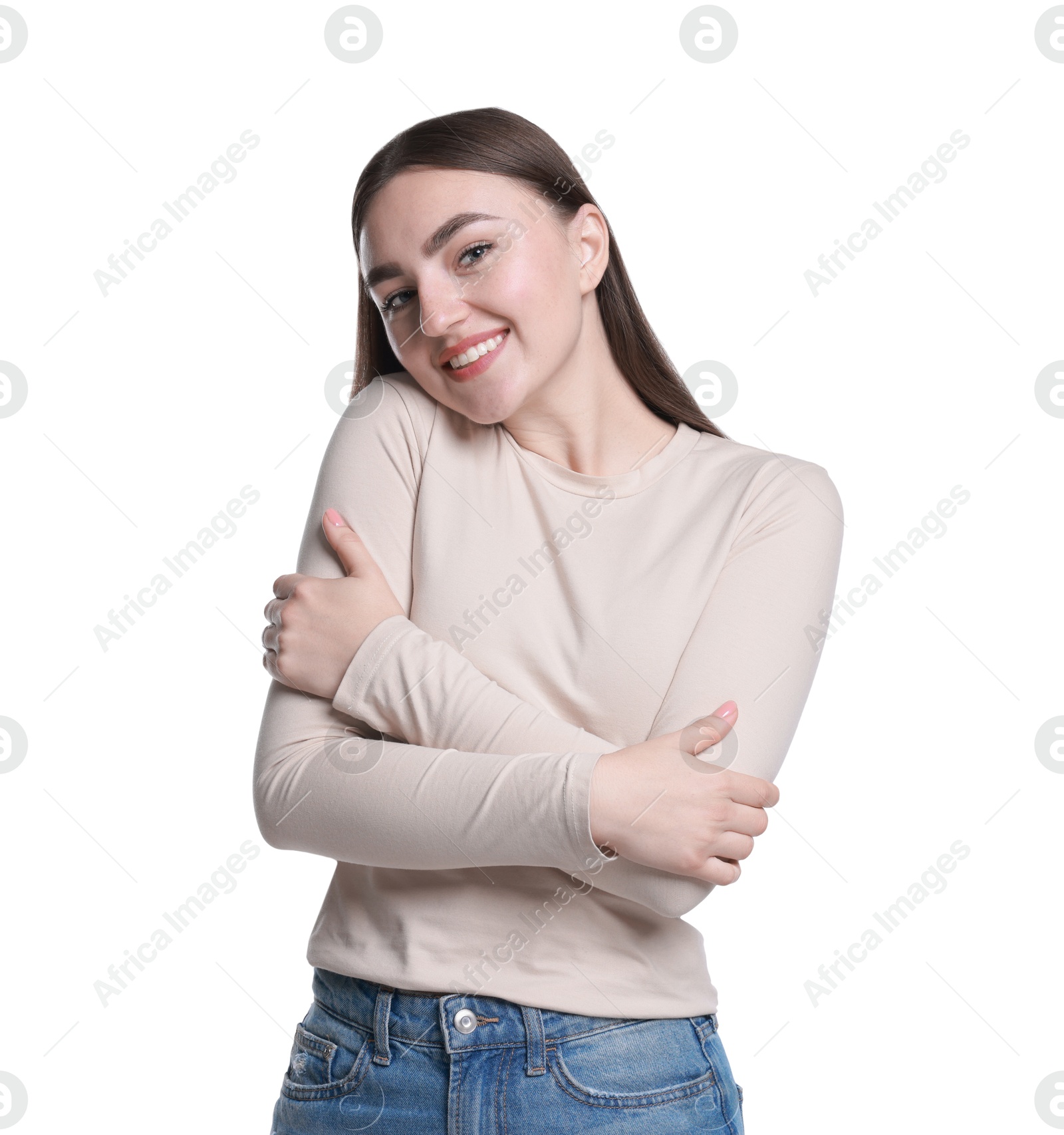 Photo of Charming young woman hugging herself on white background