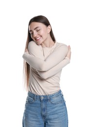 Photo of Charming young woman hugging herself on white background