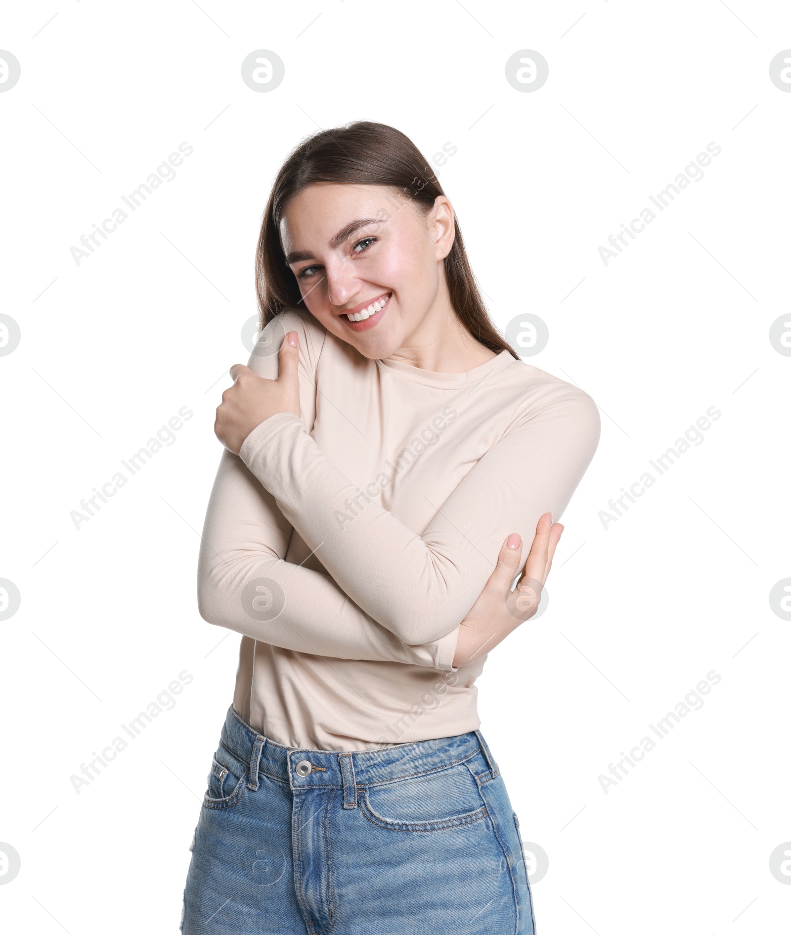 Photo of Charming young woman hugging herself on white background