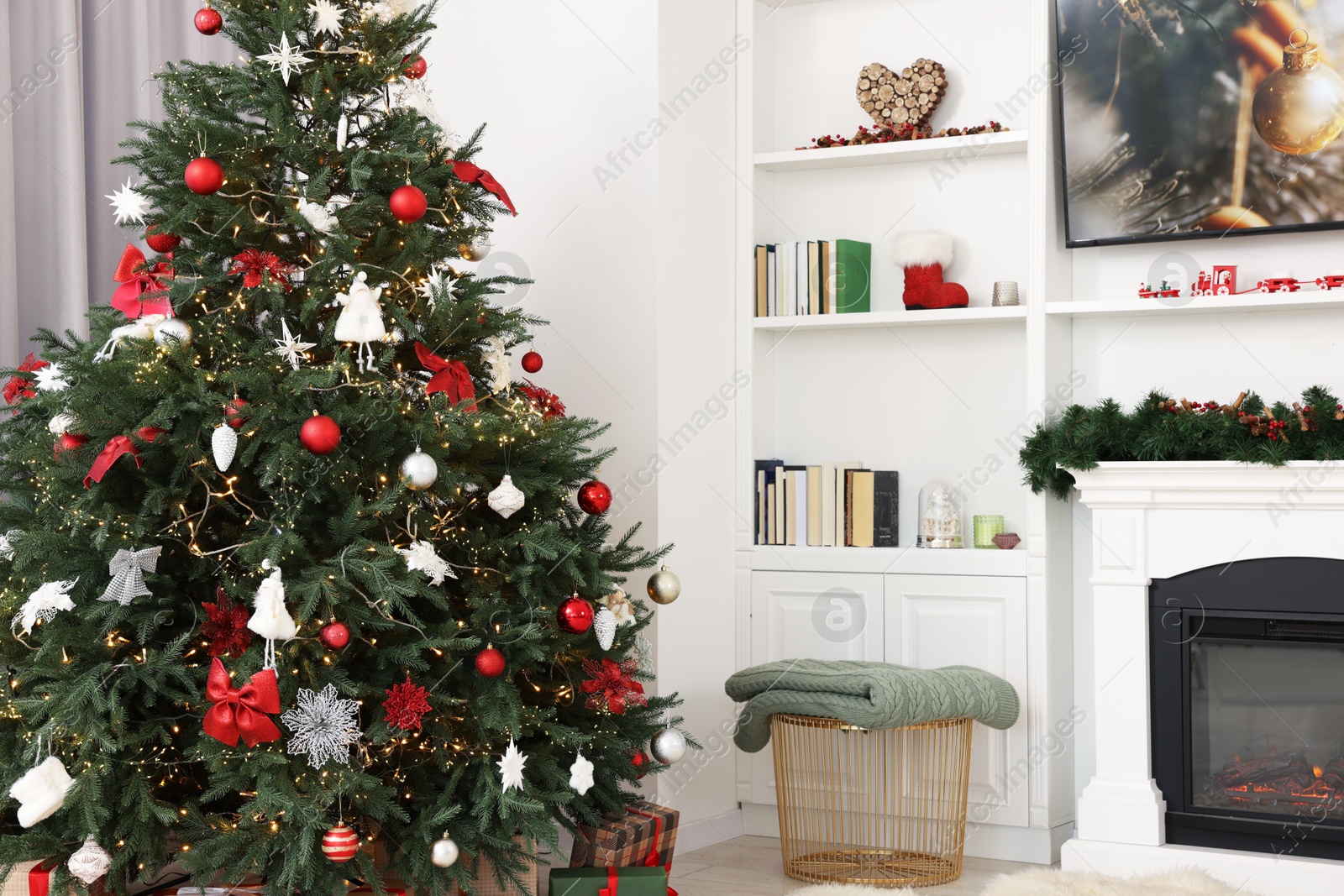 Photo of Beautifully decorated Christmas tree indoors. Festive interior design