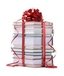 Photo of Stack of books with red bow as gift isolated on white