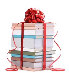 Photo of Stack of books with red bow as gift isolated on white