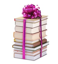 Photo of Stack of books with purple bow as gift isolated on white