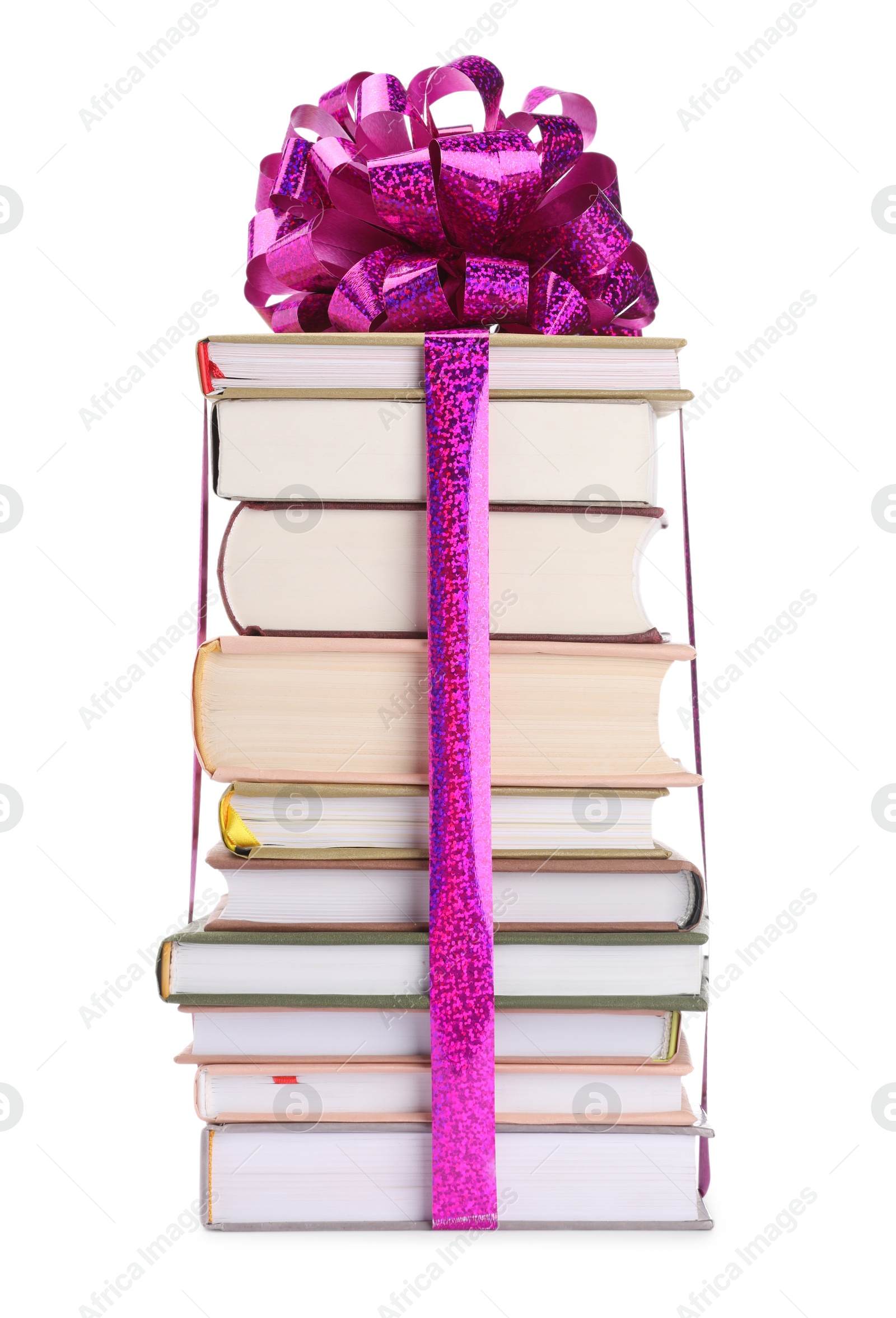 Photo of Stack of books with purple bow as gift isolated on white