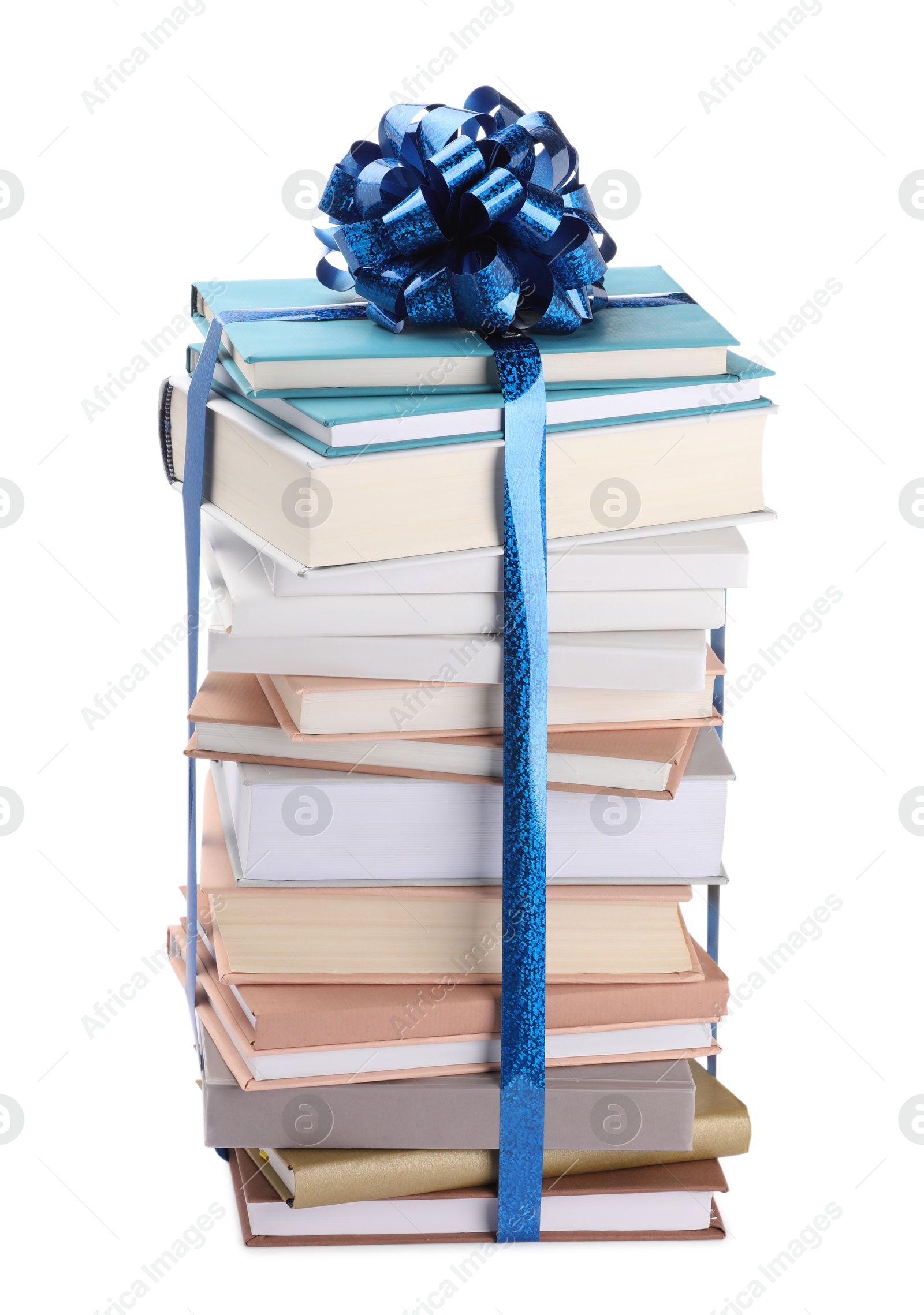 Photo of Stack of books with blue bow as gift isolated on white