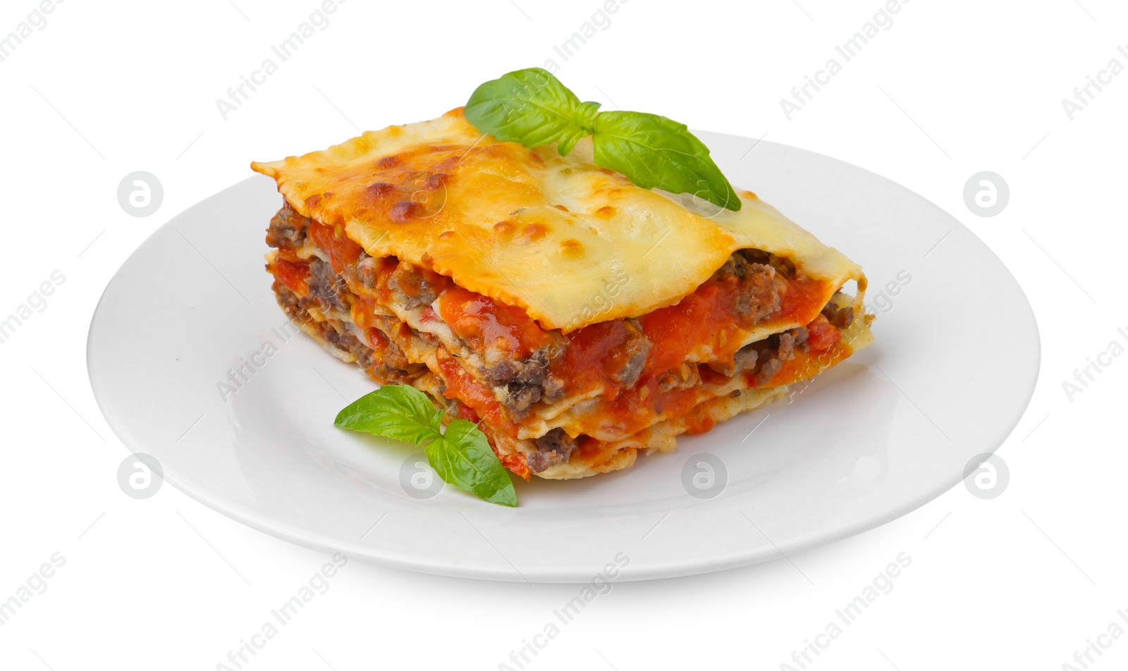 Photo of Piece of delicious cooked lasagna with basil isolated on white