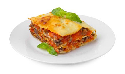 Photo of Piece of delicious cooked lasagna with basil isolated on white