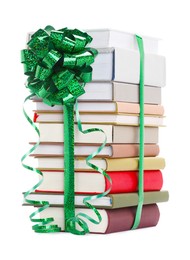 Photo of Stack of books with green bow as gift isolated on white