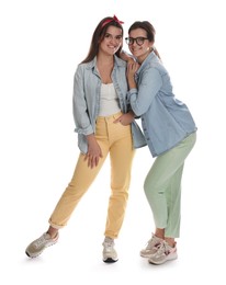 Photo of Portrait of beautiful twin sisters on white background