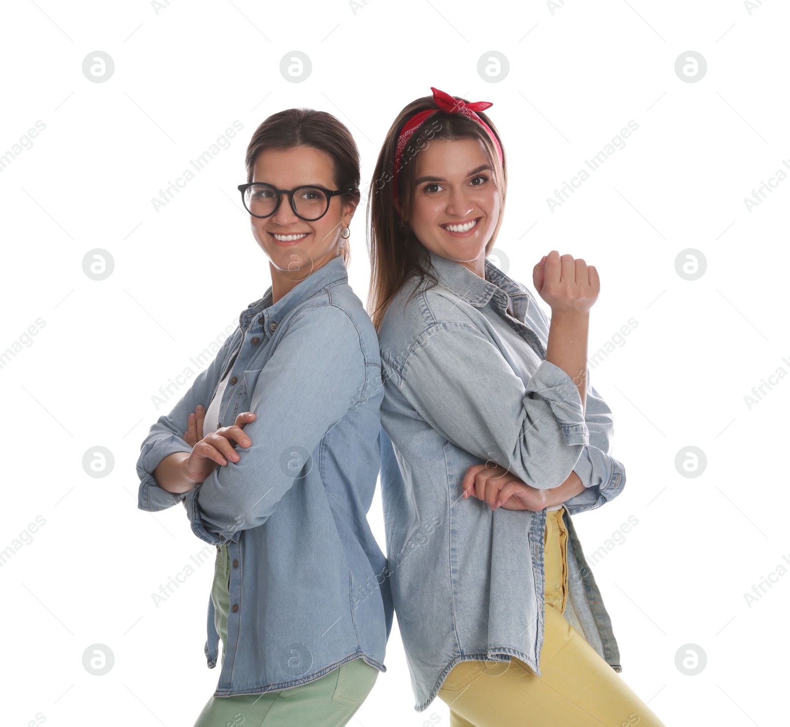 Photo of Portrait of beautiful twin sisters on white background