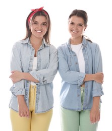 Photo of Portrait of beautiful twin sisters on white background