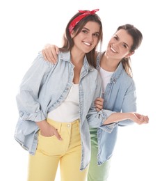 Photo of Portrait of beautiful twin sisters on white background