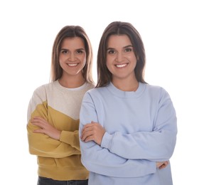 Photo of Portrait of beautiful twin sisters on white background