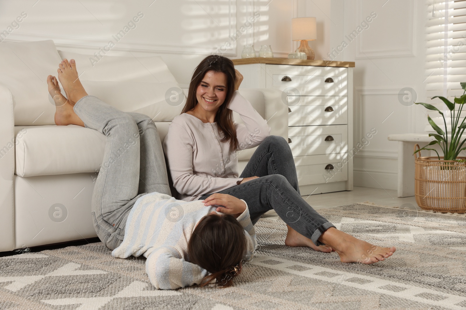 Photo of Portrait of beautiful twin sisters at home