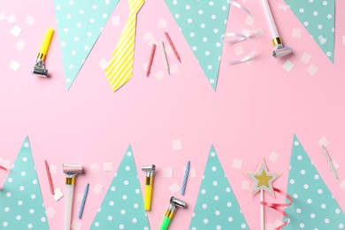 Photo of Confetti, garlands, party horns and candles on pink background, flat lay. Space for text