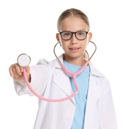 Photo of Girl with stethoscope pretending to be doctor on white background. Dreaming of future profession