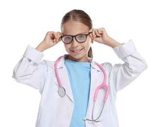 Photo of Girl with stethoscope pretending to be doctor on white background. Dreaming of future profession