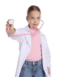 Photo of Girl with stethoscope pretending to be doctor on white background. Dreaming of future profession