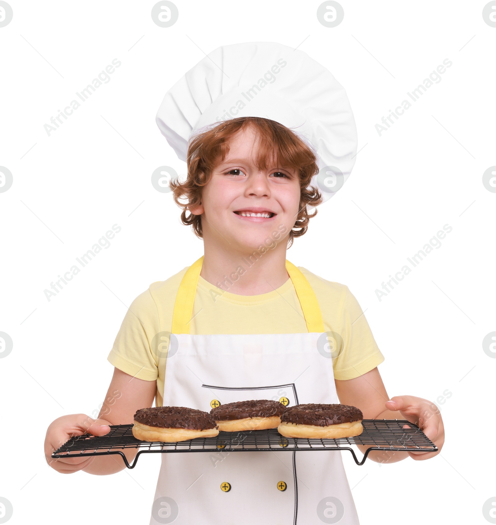 Photo of Little boy with donuts pretending to be pastry chef on white background. Dreaming about future profession