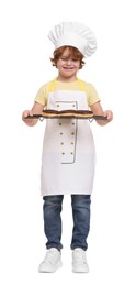 Photo of Little boy with donuts pretending to be pastry chef on white background. Dreaming about future profession