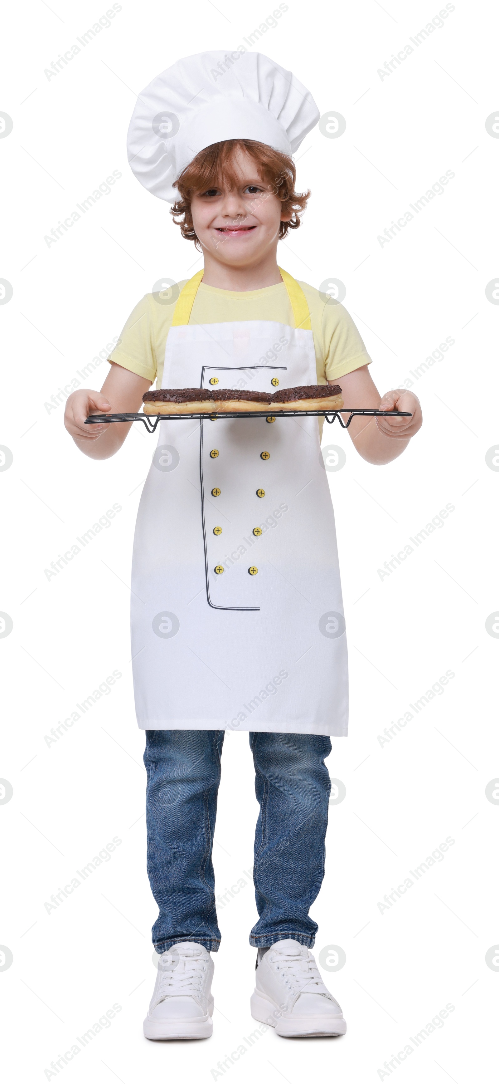 Photo of Little boy with donuts pretending to be pastry chef on white background. Dreaming about future profession