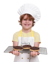 Photo of Little boy with donuts pretending to be pastry chef on white background. Dreaming about future profession