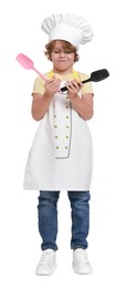 Photo of Little boy with utensils pretending to be chef on white background. Dreaming about future profession