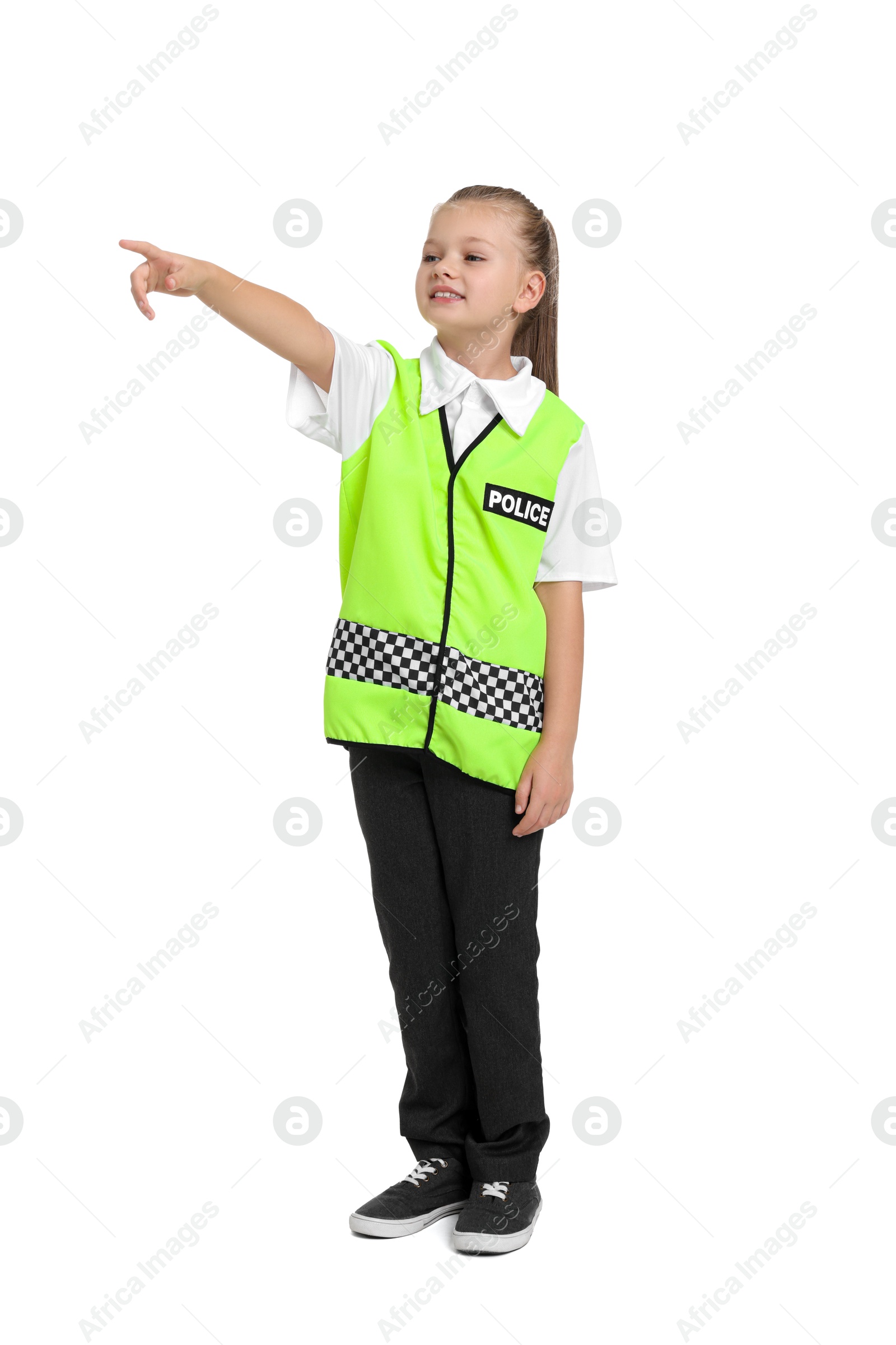 Photo of Little girl pretending to be policewoman on white background. Dreaming of future profession