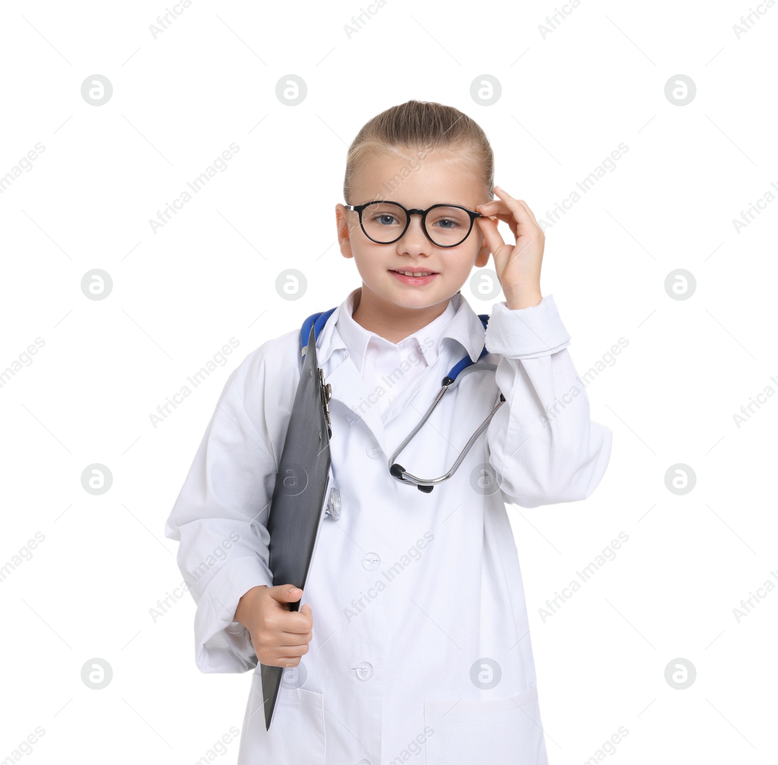 Photo of Little girl with stethoscope and clipboard pretending to be doctor on white background. Dreaming of future profession