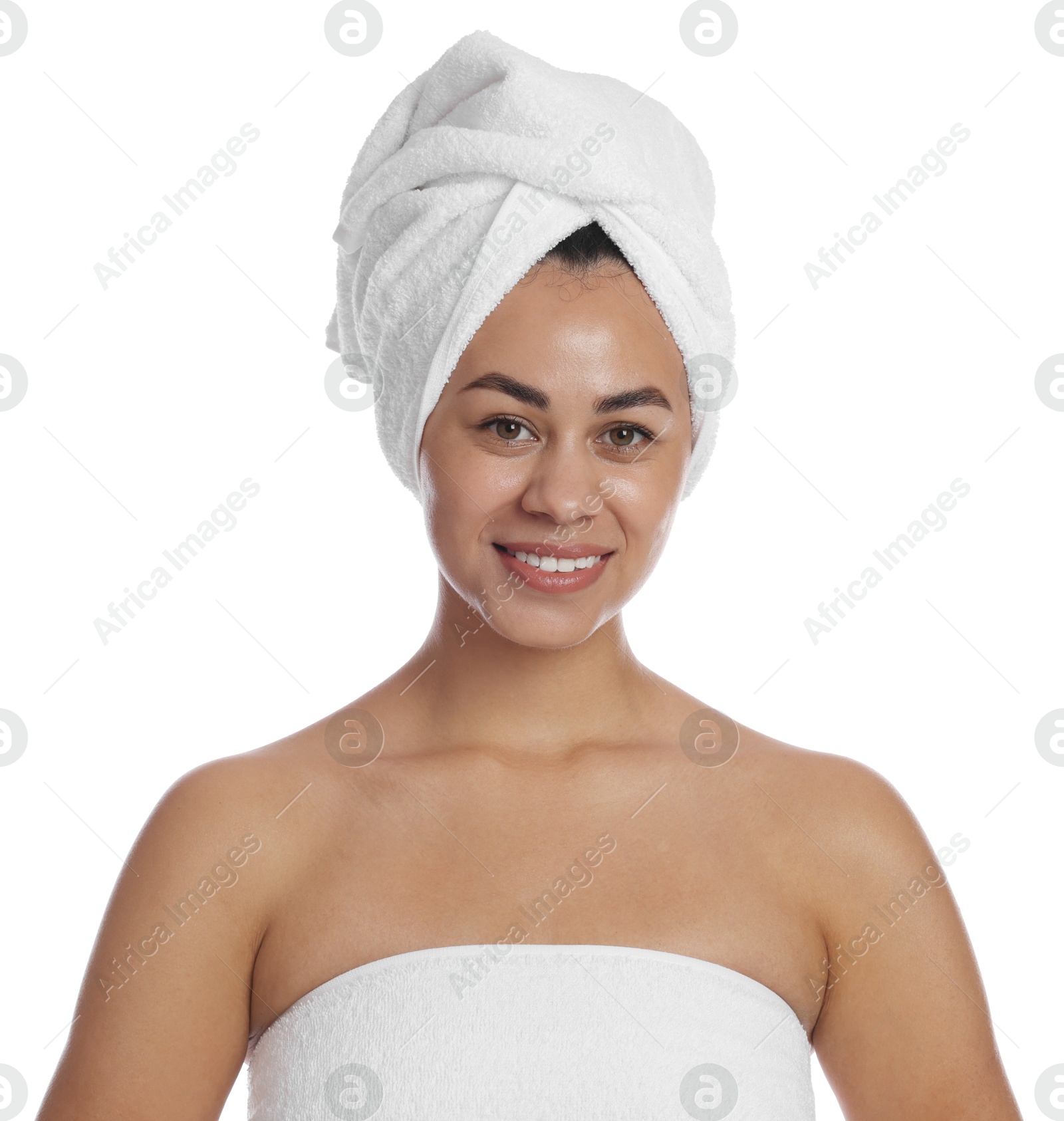 Photo of Beautiful young woman with towels on white background