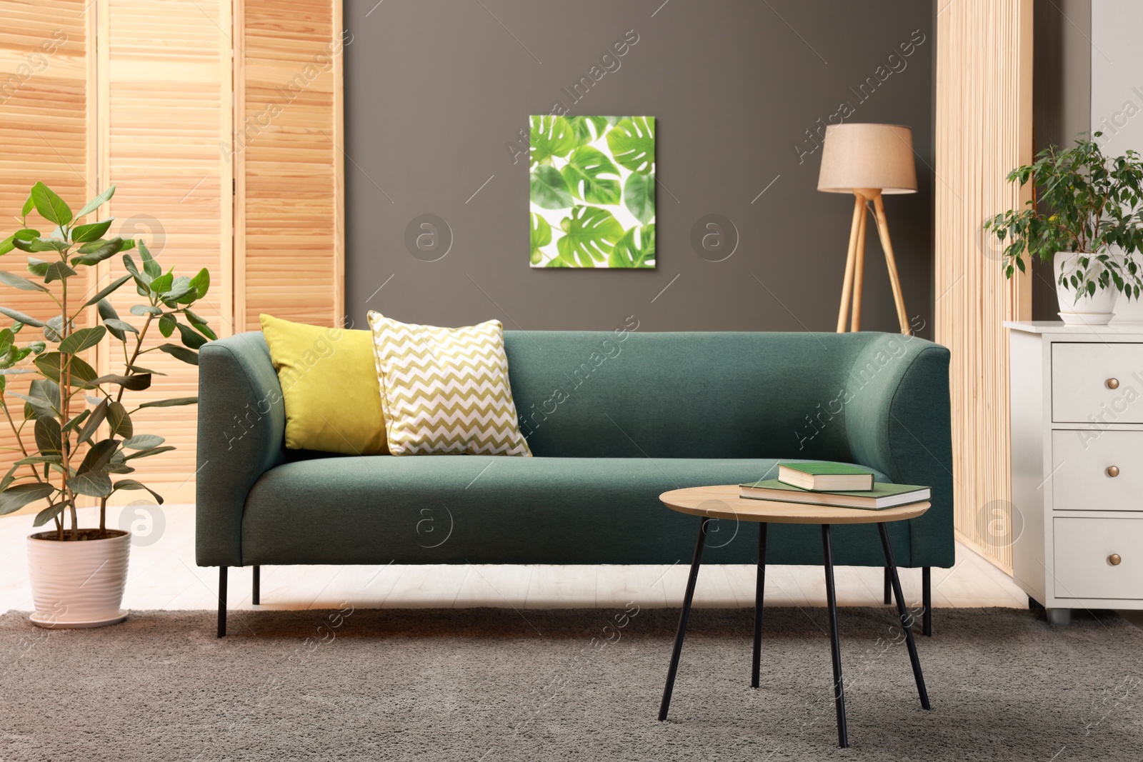 Photo of Stylish living room interior with comfortable sofa near grey wall