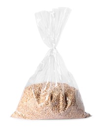 Photo of Plastic bag with wheat grains isolated on white