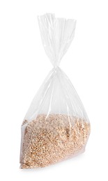 Photo of Plastic bag with wheat grains isolated on white