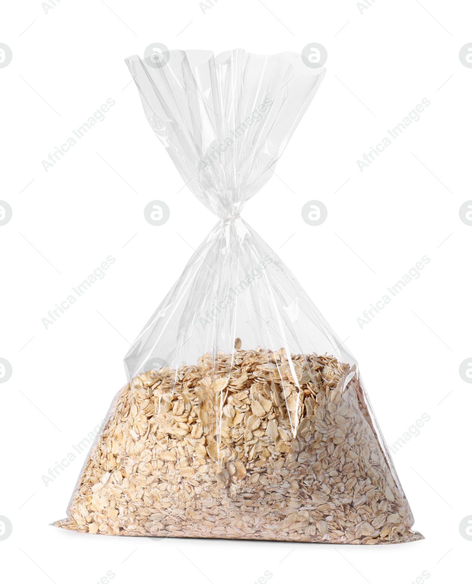 Photo of Plastic bag with oat flakes isolated on white