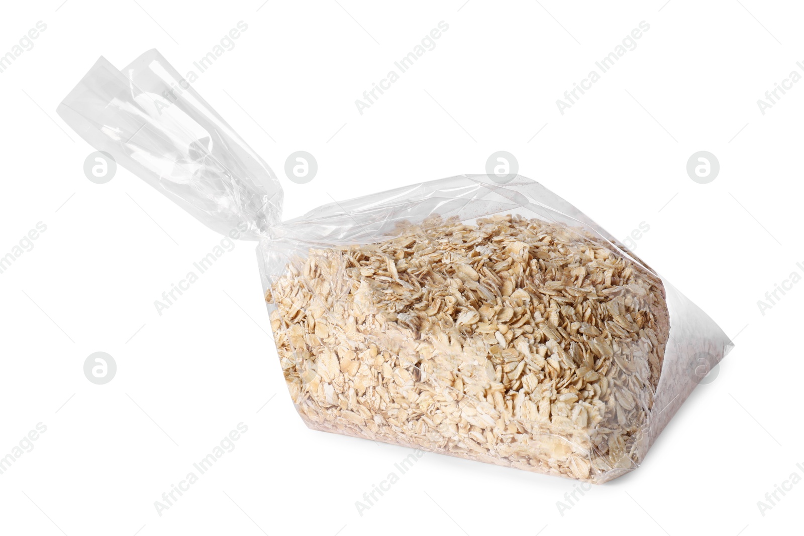 Photo of Plastic bag with oat flakes isolated on white