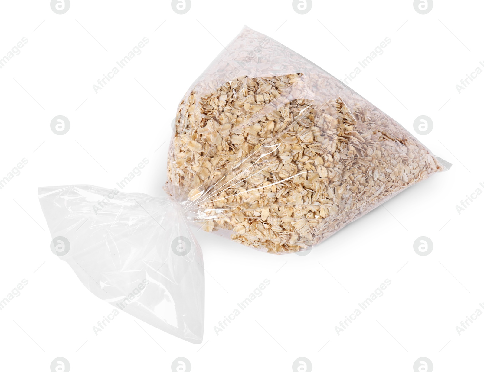 Photo of Plastic bag with oat flakes isolated on white, top view