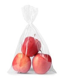 Photo of Plastic bag with red apples isolated on white