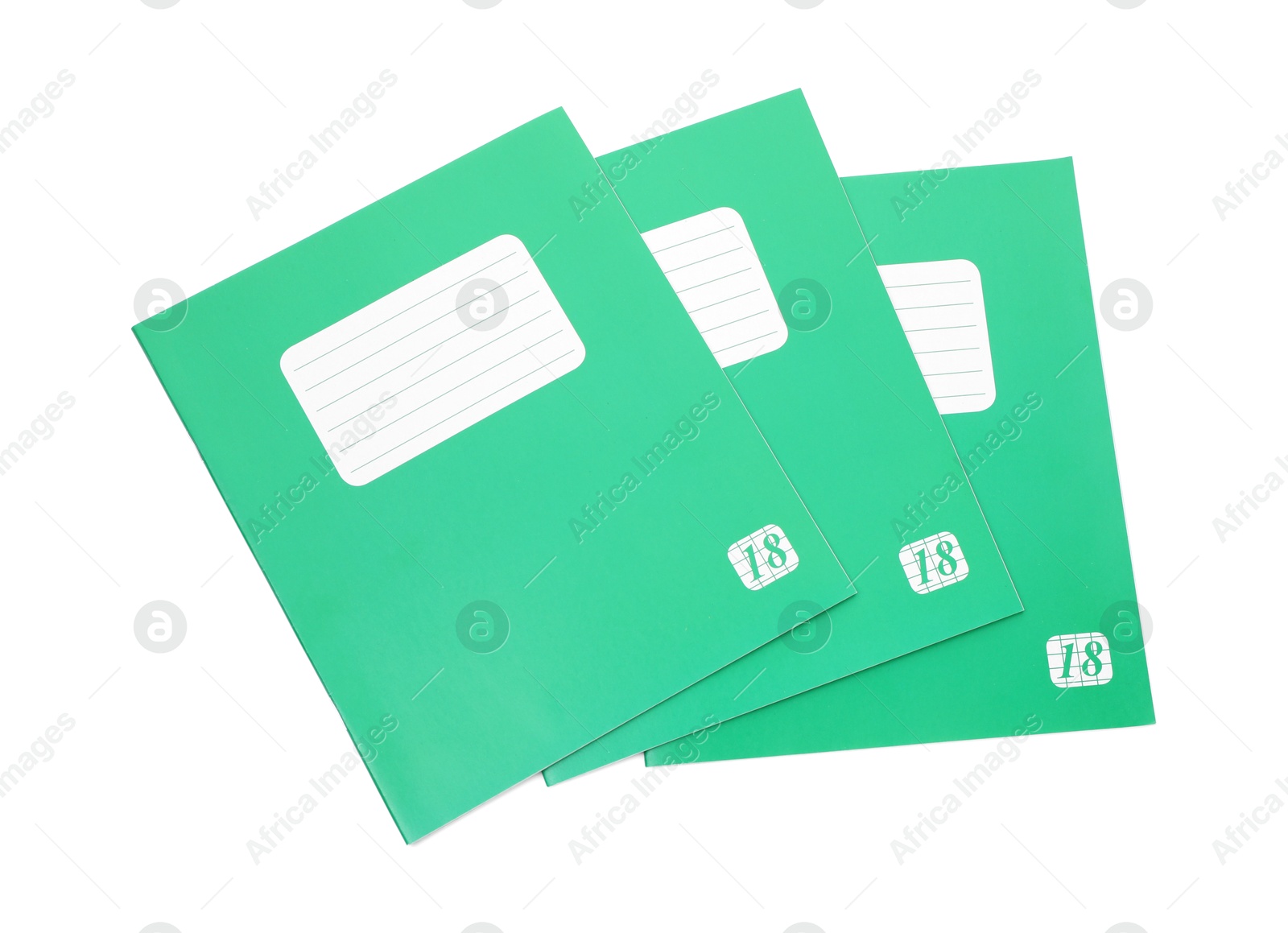 Photo of Green copybooks isolated on white, top view. School stationery