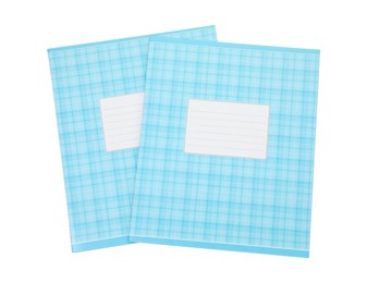 Photo of Blue copybooks isolated on white, top view. School stationery