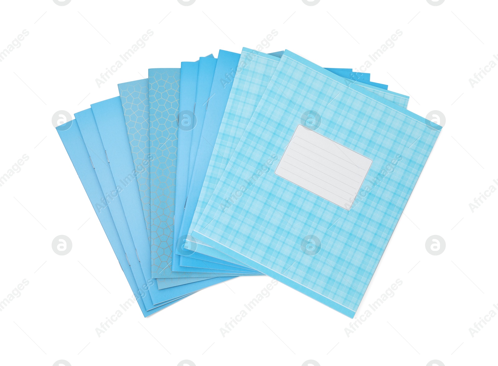 Photo of Blue copybooks isolated on white, top view. School stationery