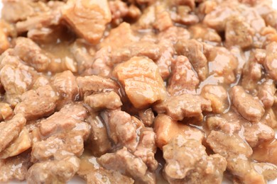 Photo of Pieces of wet pet food as background