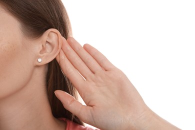 Photo of Woman showing hand to ear gesture on white background, closeup