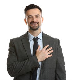 Photo of Man making promise on white background. Oath gesture