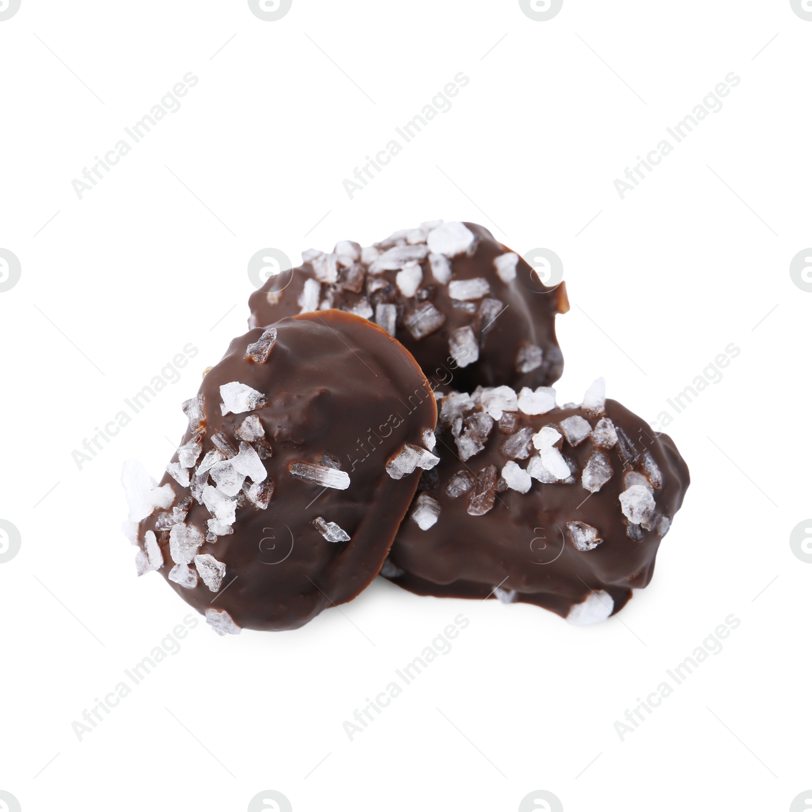 Photo of Tasty chocolate candies with salt isolated on white