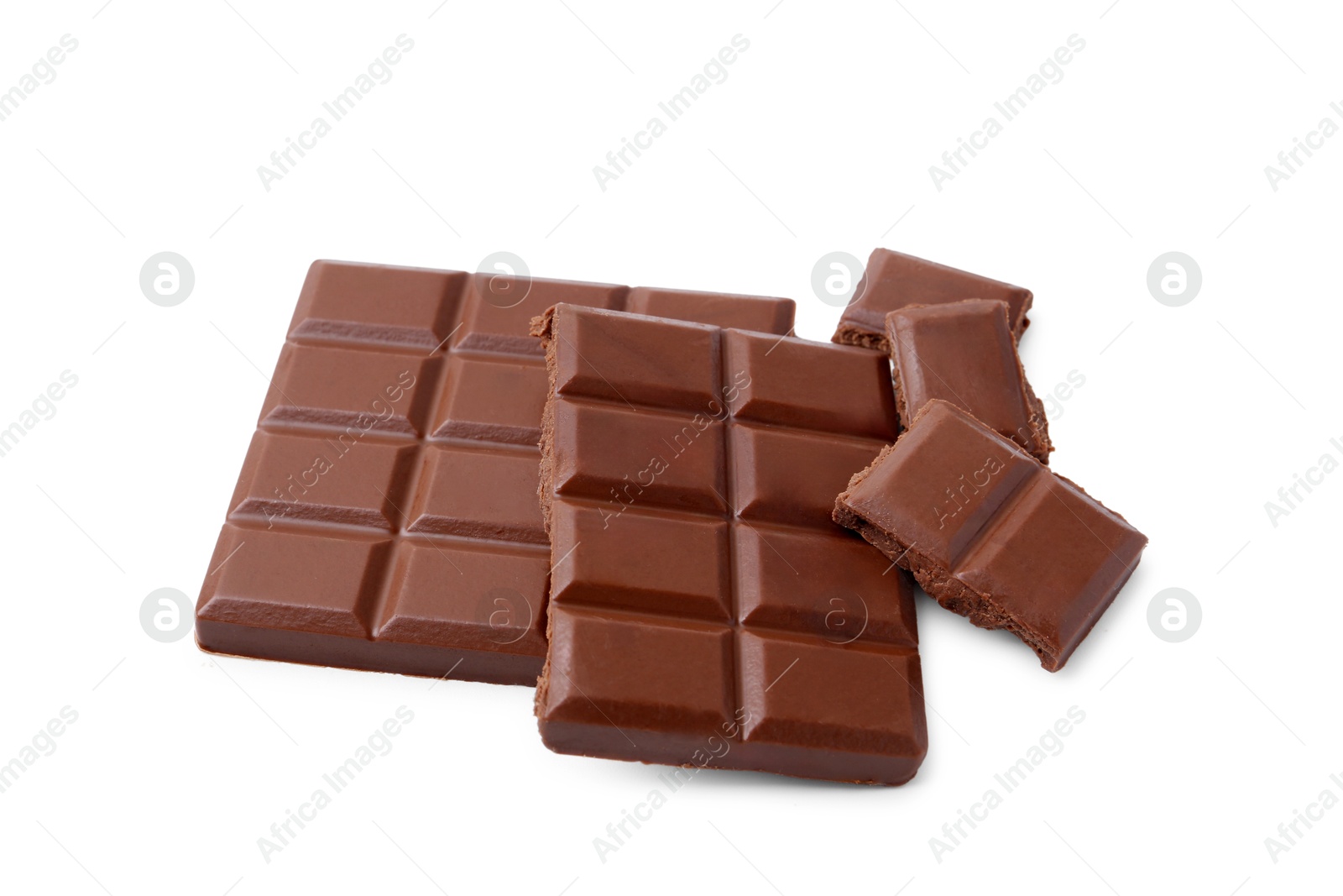 Photo of Pieces of delicious milk chocolate isolated on white