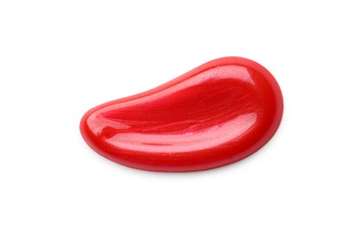 Photo of Red lip gloss isolated on white, top view. Sample of cosmetic product